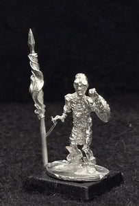 57-0703:  Skeleton with Two Handed Weapon and Round Shield