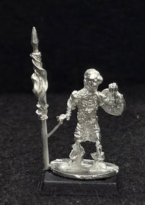 57-0703:  Skeleton with Two Handed Weapon and Round Shield