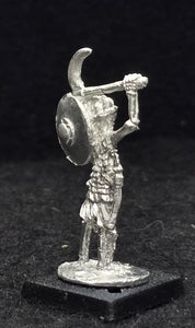 57-0717:  Skeleton with Sickle and Shield, Longer Garment